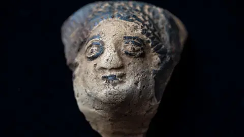 Tony Jolliffe BBC A pottery head detached from a Roman vessel found in Northamptonshire